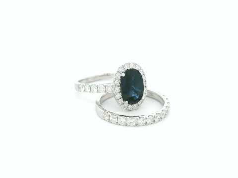 18K white gold blue sapphire and diamond bridal ring set with halo engagement ring and diamond wedding band by Emirates Diamonds