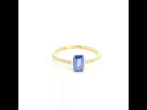18K Yellow Gold Emerald Cut Tanzanite Ring featuring a 0.49 carat natural emerald cut tanzanite with 0.14 carat natural diamond shoulders in a classic solitaire design.