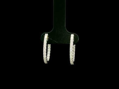 18K white gold inside out diamond hoop earrings with round brilliant diamonds set along the outer front and inner back surfaces.