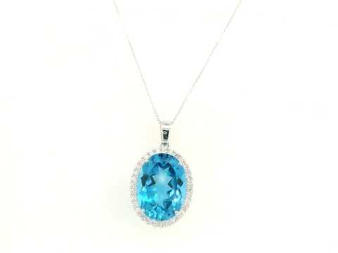 Swiss blue topaz diamond halo pendant in 18K white gold featuring a 21.51 carat oval Swiss blue topaz and 0.76 carats of diamonds by Emirates Diamonds.