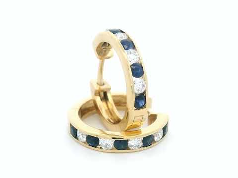 18K gold sapphire and diamond hoop earrings with alternating gemstones.

