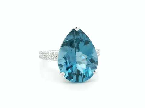 London blue topaz ring in 18K white gold with oval 9.07 carat gemstone and pavé diamond band by Emirates Diamonds