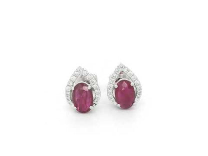 18K white gold ruby and diamond stud earrings featuring oval-cut rubies with diamond accents by Emirates Diamonds.
