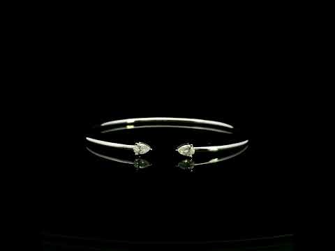 18K white gold open cuff bangle featuring pear-shaped natural diamonds with a total diamond weight of 0.61 Carat.