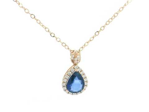Blue sapphire pendant with diamond halo and tulip bail in 18K rose gold