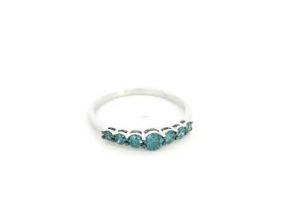 Shop a 0.50 carat blue diamond half eternity ring in 18K white gold. A bold, stackable luxury band by Emirates Diamonds.
