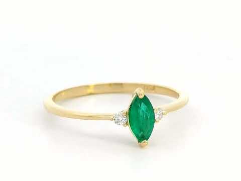 Elegant 18K gold marquise-cut emerald and diamond ring featuring a 0.21-carat emerald and 0.03-carat diamond accents.