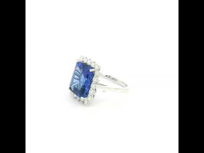 8.78 carat emerald cut tanzanite and diamond halo ring in 18K white gold