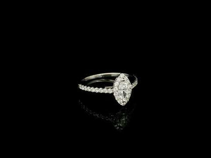 18K white gold marquise diamond halo engagement ring with diamond band featuring a 0.29 carat natural marquise cut centre diamond.