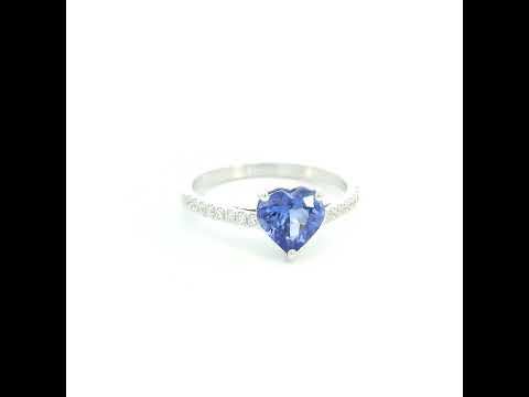 Heart Tanzanite Diamond Ring in 18K white gold featuring a natural 1.08 carat heart-cut tanzanite with a diamond-set band.