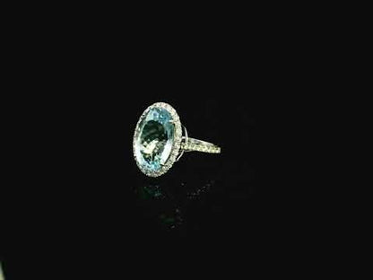 18K white gold aquamarine diamond halo ring 10.47 carat oval aquamarine with diamond halo – Emirates Diamonds