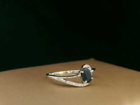 18k white gold ring with 0.63ct oval sapphire & 0.08ct diamond swirl – certificate included
