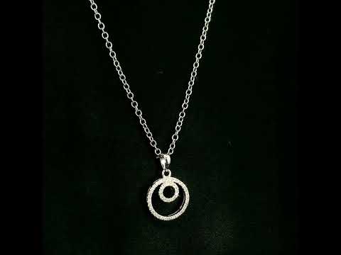 Diamond circle pendant with interlocking open-circle design in 18K white gold, set with round brilliant diamonds.