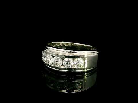 Men's 18K white gold band with five round diamonds in a channel-style setting framed by broad polished gold edges.
