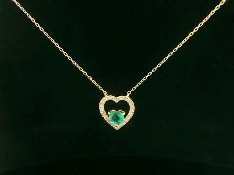 Heart-shaped emerald and diamond necklace in 18K yellow gold