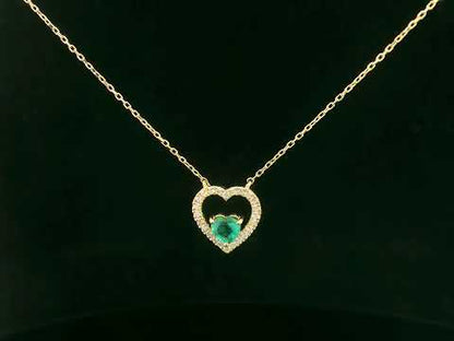 Heart-shaped emerald and diamond necklace in 18K yellow gold