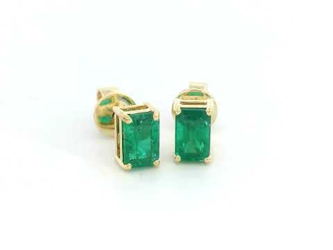 18K yellow gold emerald-cut emerald stud earrings with four-prong setting and butterfly backs.