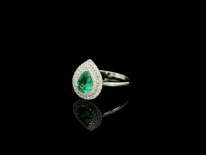 18K white gold pear shaped emerald and diamond halo ring with green emerald surrounded by round diamonds