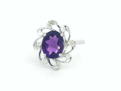18K white gold ring with oval-cut 2.15ct amethyst and 0.03ct diamond accents in floral-inspired design

