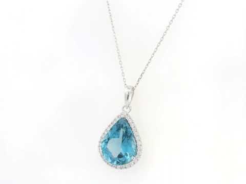 18K white gold pear shape London Blue Topaz pendant with diamond halo featuring a 9.10 carat natural London Blue Topaz and 0.39 carat natural diamonds.