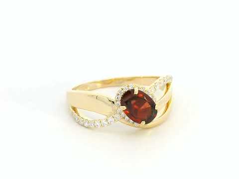 18K yellow gold garnet ring with 1.25ct oval garnet and 0.21ct diamond split-shank design – Emirates Diamonds