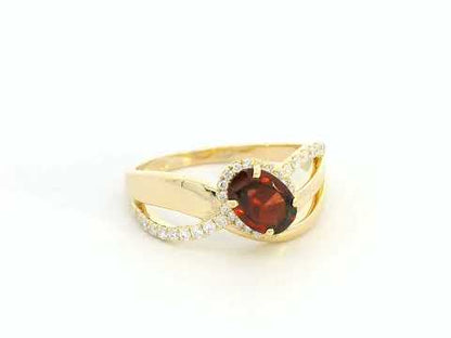 18K yellow gold garnet ring with 1.25ct oval garnet and 0.21ct diamond split-shank design – Emirates Diamonds