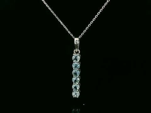 18k gold vertical bar pendant with six round-cut aquamarines totaling 0.72 carat