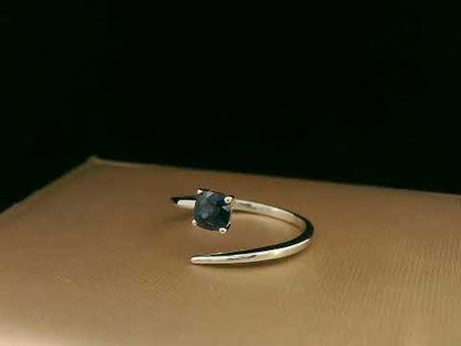 18K gold bypass ring with 0.49 carat cushion-cut blue sapphire, sleek modern design