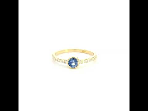 18K yellow gold bezel blue sapphire diamond ring featuring a 0.62 Carat natural round sapphire with diamond-set shoulders.