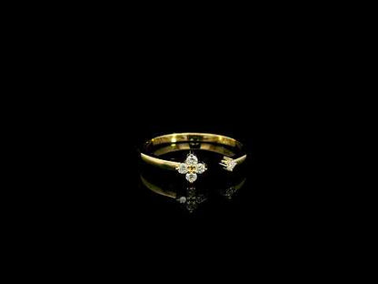 Open diamond flower ring in 18K yellow gold with four-petal diamond floral design and single diamond accent