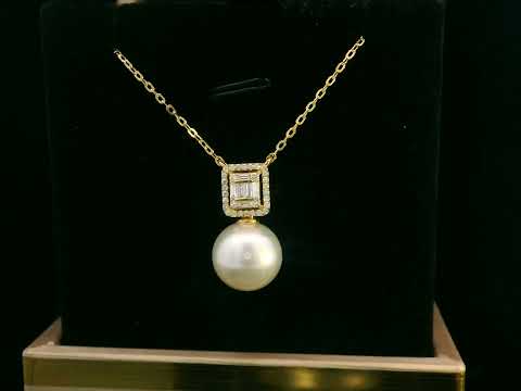 18K gold pendant featuring a South Sea pearl with a 0.26ct diamond halo of baguette and round diamonds.