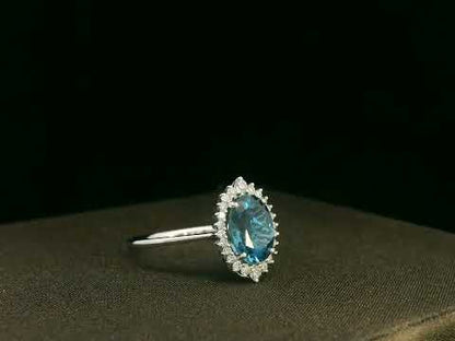 18k white gold London Blue Topaz and diamond halo ring