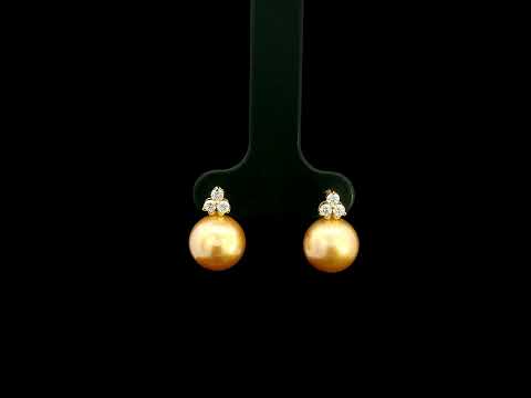 South Sea golden pearl and diamond stud earrings in 18K yellow gold with 8 x 8.5 mm pearls and three-diamond accents