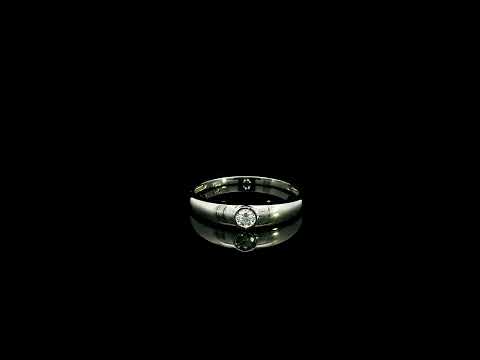 18K white gold bezel set solitaire diamond ring featuring a 0.11 carat natural round brilliant diamond with a smooth polished band.