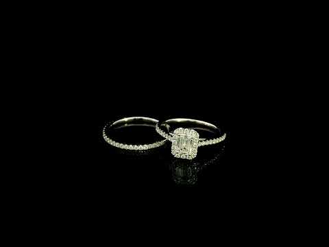 Emerald cut diamond halo bridal set in 18K white gold with a diamond engagement ring and matching wedding band.