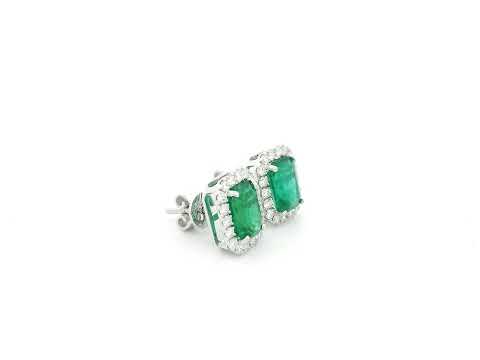 Emerald cut emerald and diamond halo stud earrings in 18K white gold Emirates Diamonds