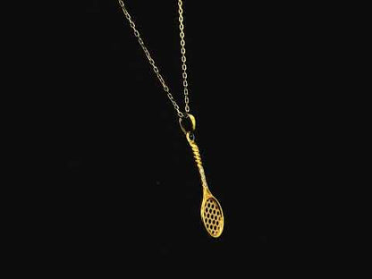 18K yellow gold tennis racket pendant necklace with diamond accents by Emirates Diamonds