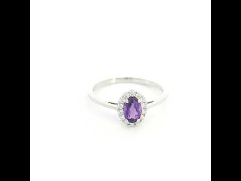 Oval amethyst ring with diamond halo in 18K white gold