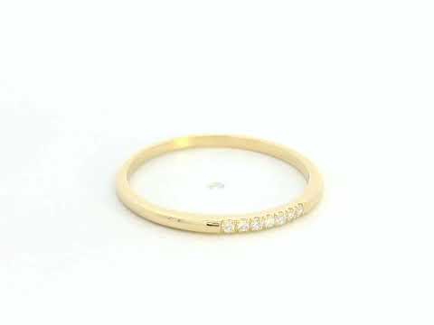 Dainty diamond stacking ring in 18K yellow gold by Emirates Diamonds