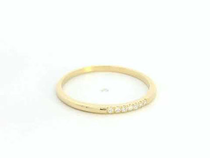 Dainty diamond stacking ring in 18K yellow gold by Emirates Diamonds