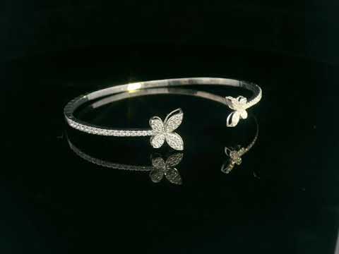 18K gold butterfly bangle with 0.86 carat pavé diamonds in open cuff design


