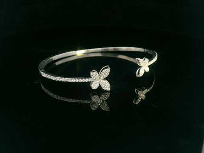 18K gold butterfly bangle with 0.86 carat pavé diamonds in open cuff design

