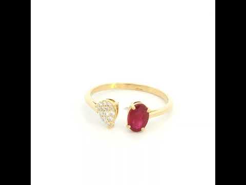Oval ruby and diamond open ring in 18K yellow gold with pear shaped diamond cluster