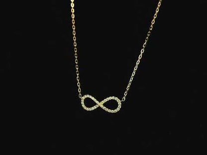 Diamond infinity necklace in 18K yellow gold featuring 0.19 carats of diamonds by Emirates Diamonds.