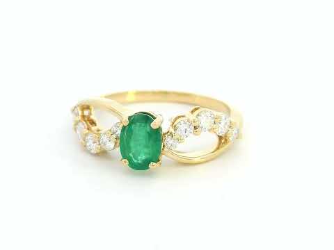 Oval-cut emerald and diamond ring in yellow gold
