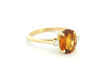 Minimalist gemstone ring with citrine center and side diamonds