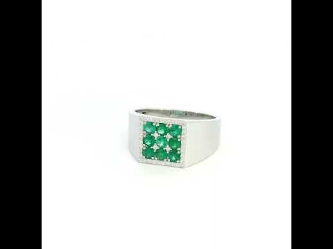 Men’s emerald and diamond signet ring in 18K white gold with nine round emeralds framed by natural diamonds.