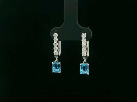 18K white gold dangle earrings with 2.32 ct emerald-cut blue topaz and 0.58 ct round diamonds
