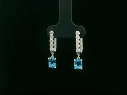 18K white gold dangle earrings with 2.32 ct emerald-cut blue topaz and 0.58 ct round diamonds