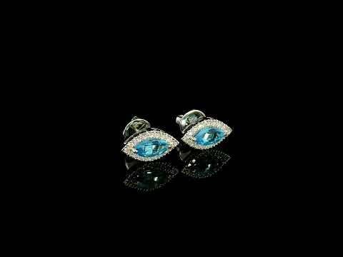18K white gold blue topaz and diamond halo stud earrings featuring marquise-shaped blue topaz gemstones surrounded by round diamonds in an eye-shaped design.